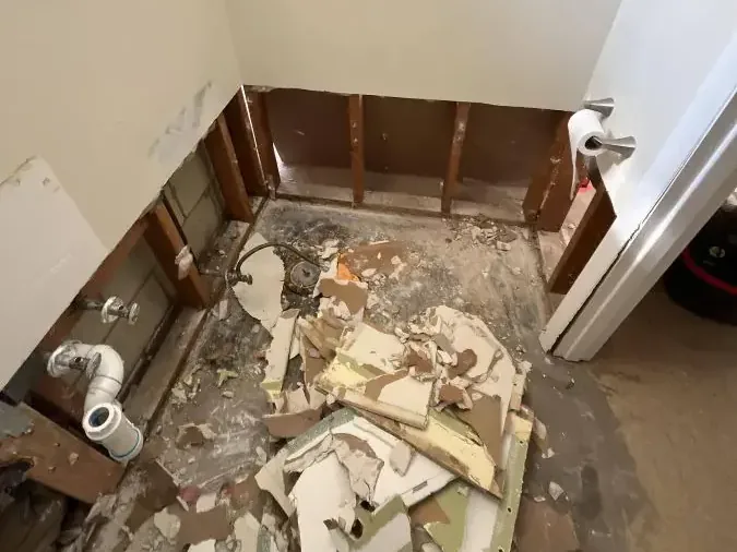 Bathroom stripped to the studs after a sewage backup cleanup